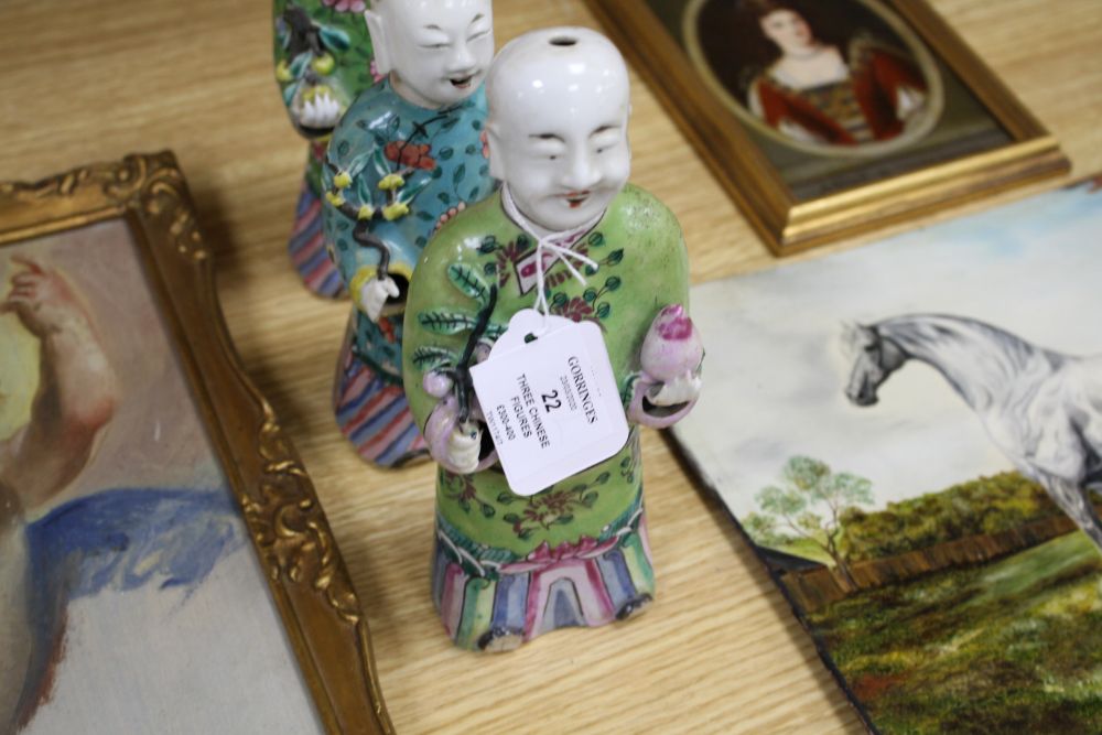 A near pair of Chinese polychrome-decorated figural incense burners and another similar incense burner, Jiaqing period (1796-1820)